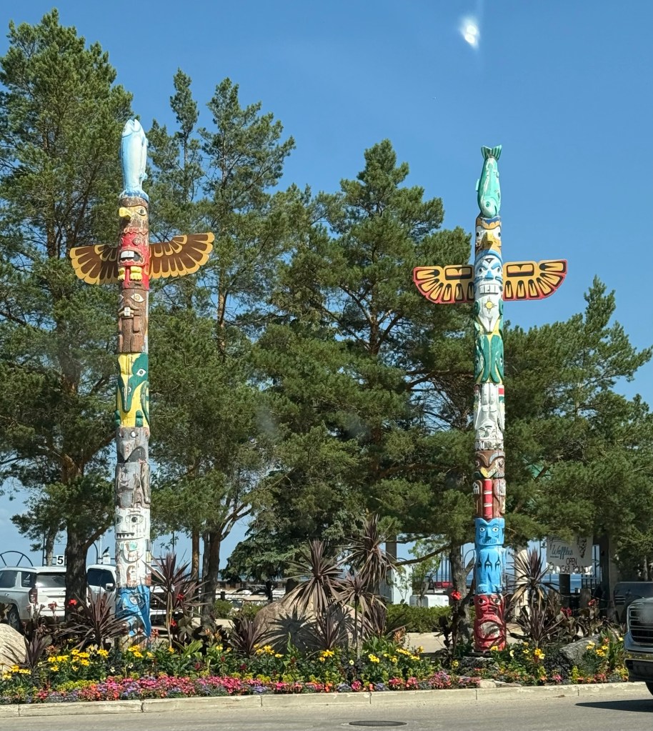 The entrance of the marina hosts two totem poles.